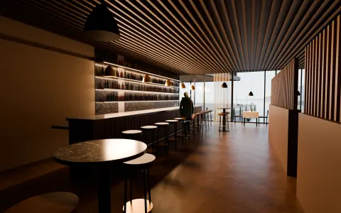 Restauranten sett fra baren, med høye krakker og vinduer mot sjøen, dag